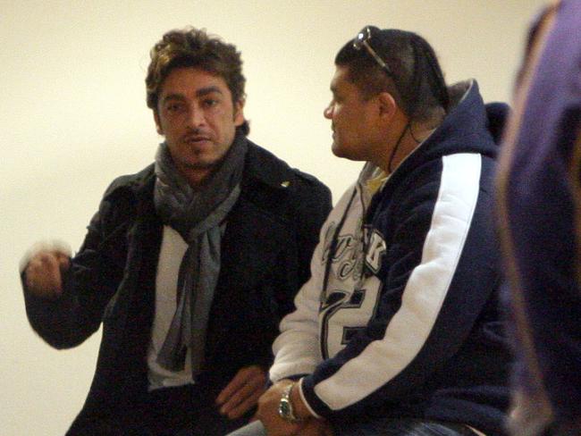 John Ibrahim speaks to an associate at Royal North Shore Hospital while waiting on news of his brother’s condition.