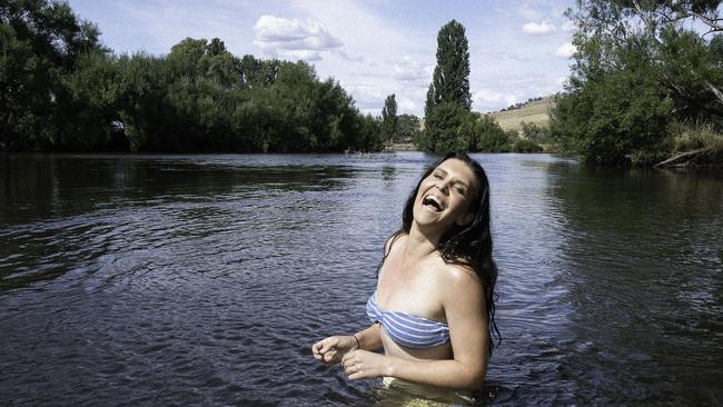 Country singer-songwriter Fanny Lumsden cools off in the Murray River at Tooma in the NSW Riverina. Picture: Dan Stanley Freeman