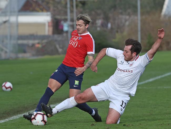 NPL South Hobart vs. Glenorchy Knights, South Hobart Oval: South Hobart's Iskander Van Doorne contests for possession with Glenorchy's Luke Warrener (right). Picture: LUKE BOWDEN