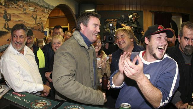 Then-Channel 9 chief executive Eddie McGuire celebrates with locals at the Club Hotel after the rescue of Beaconsfield miners Brant Webb and Todd Russell. Picture: AAP