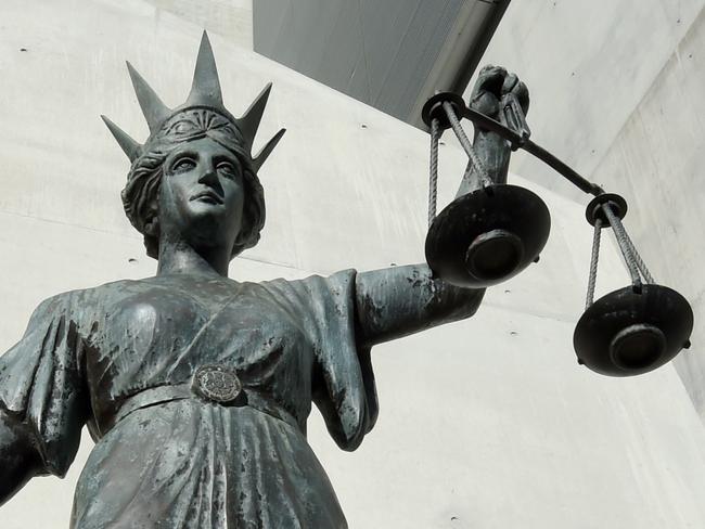 A statue of Themis, the Greek God of Justice stands outside the Supreme Court in Brisbane, Thursday, Oct. 20, 2016. (AAP Image/Dave Hunt) NO ARCHIVING