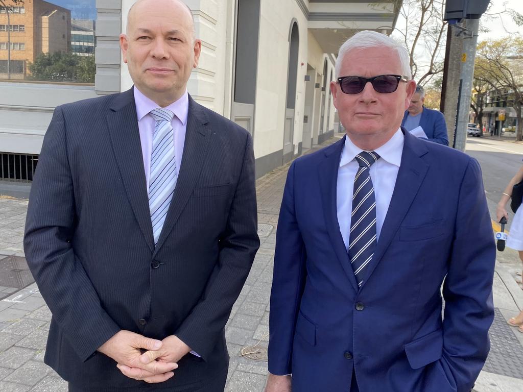 Marion Council Mayor Kris Hanna (left) leaves court with his lawyer, former deputy premier John Rau SC. Hanna has pleaded guilty to publishing election material containing an inaccurate statement. Picture: Kathryn Bermingham