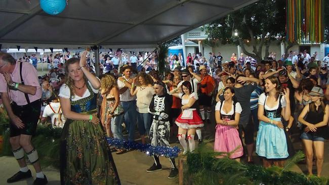 Redland mayor Karen Williams leads the chicken dance onstage at the Emu Park Oktoberfest.