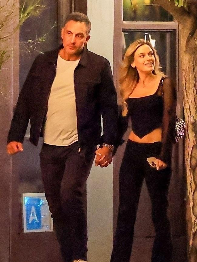 He walked hand in hand with the mystery woman. Picture: BACKGRID
