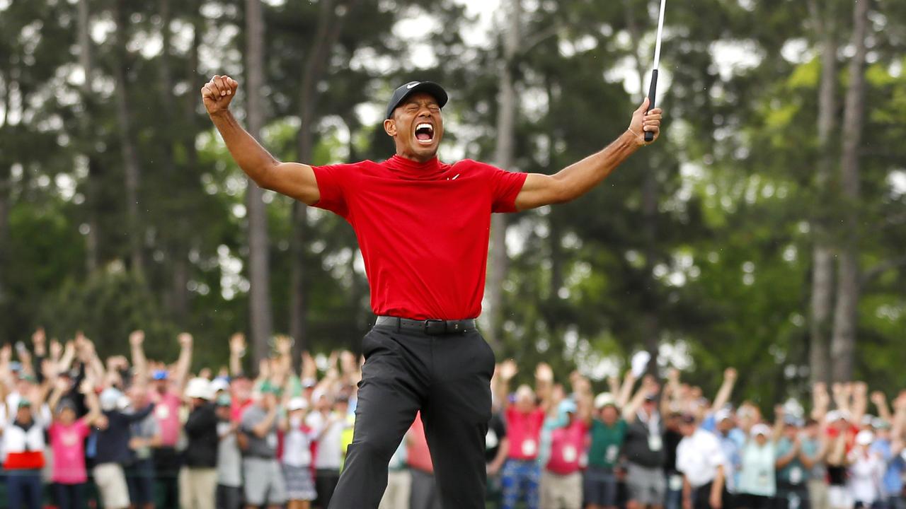 AUGUSTA, GEORGIA - APRIL 14: Tiger Woods of the United States celebrates after sinking his putt on the 18th green to win during the final round of the Masters at Augusta National Golf Club on April 14, 2019 in Augusta, Georgia. (Photo by Kevin C. Cox/Getty Images)