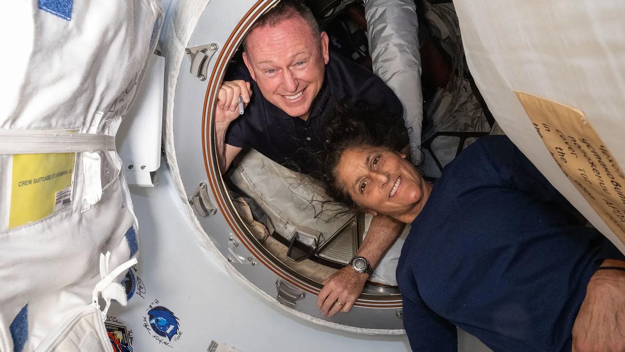 Boeing Starliner astronauts Butch Wilmore and Suni Williams’ eight-day mission will blow out to more than eight months. They’re pictured inside the vestibule between the forward port on the International Space Station and Boeing's Starliner spacecraft. Picture: AFP Photo/NASA