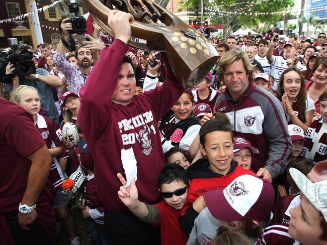 Captain Jamie Lyon and coach Des Hasler with fans and the premiership trophy as the Manly Sea Eagles NRL team parade through the streets of Manly after their victory in the Manly Sea Eagles v New Zealand Warriors 2011 NRL Grand Final at ANZ Stadium, Olympic Park, Homebush, Sydney on 02/10/2011.
