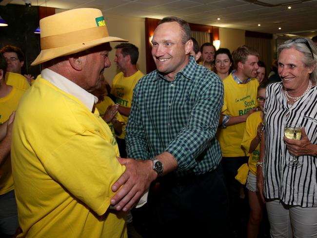 Nationals candidate for Orange, Scott Barrett shaking hands with his father Ian Barrett with his mother Belinda by his side at the Orange City Bowling Club after the Orange by-election. Picture: Jonathan Ng