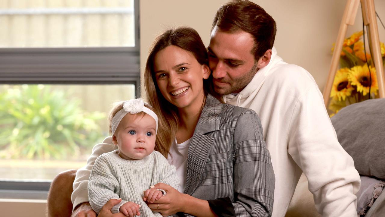 Jeremy Finlayson with Partner Kellie Gardner and daughter Sophia. The pair were engaged last week. Picture: Kelly Barnes