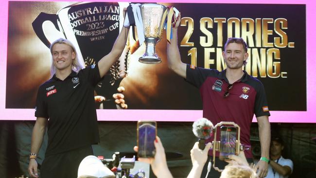 Captains Darcy Moore and Harris Andrews with the permiership trophy at Friday’s grand final parade.Picture: David Crosling