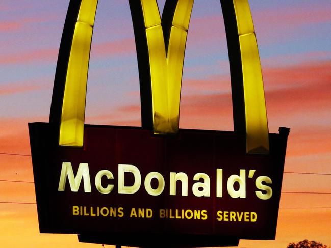 In this Saturday, Oct. 10, 2015 photo, the sun sets behind a McDonald's restaurant in Ebensburg, Pa. McDonald's reports quarterly financial results Thursday, Oct. 22, 2015. (AP Photo/Gene J. Puskar)