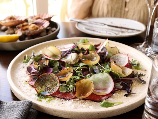 Eye fillet carpaccio with York Town greens, shaved grand padano, charred pickling onions, and dried capers. Picture: Stephanie Dalton