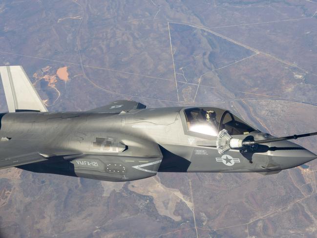 An US Marine F35 jet refuelling mid-air while travelling about 800km/h about 100km south of Darwin. Picture: Floss Adams.