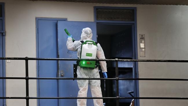 The Sunday Telegraph get an inside look into Silverwater Jail in Sydney during the COVID-19 pandemic. An inmate on the COVID cleaning team pictured deep cleaning a cell after an inmate is moved. Picture: Sam Ruttyn