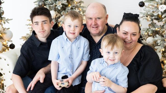 Melissa and Darren Neville with their three children.