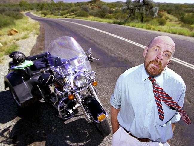 Alice Springs based disabled lawyer Chris Turner 08 May 2000 who was given permission to carry Olympic torch while riding his Harley-Davidson motor cycle.  motorbike