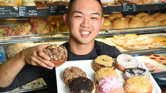 Goldeluck's Bakery owner Phillip Kuoch with the baked treats that shoppers are known to queue for. Picture: Josie Hayden