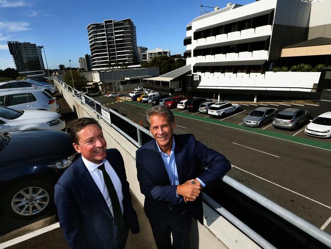 Knight Franks’ Christian Sandstrom and State Development Corporation managing director Ross McKinnon overlook the property slated for a $300 million development in Toowong. Picture: Richard Waugh/AAP