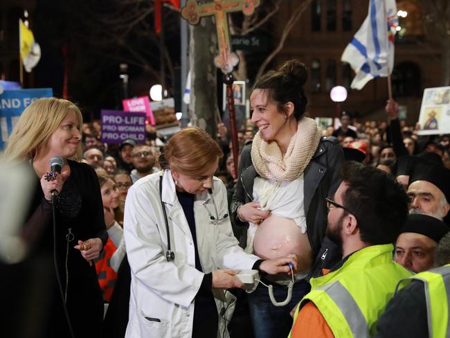 Protesters listen to the heartbeat of the unborn child of Chantal Czeczotko during a rally against the Reproductive Health Care Reform Bill 2019, in Martin Place. Picture: Justin Lloyd