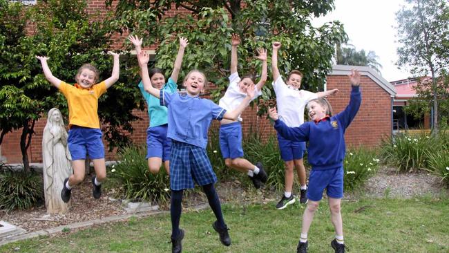 BRAIN POWER: St Carthage's Primary School students L-R Charlotte Gilliland, Neve Schweizer, Padraig Heffernan, Liam Torrens,(front) Darcy Heffernan and Chloe Lane, jump for joy as they are off to defend their champion title the Social Science division of the Tournament of Minds Australian-Pacific Final next month. Picture: Alison Paterson