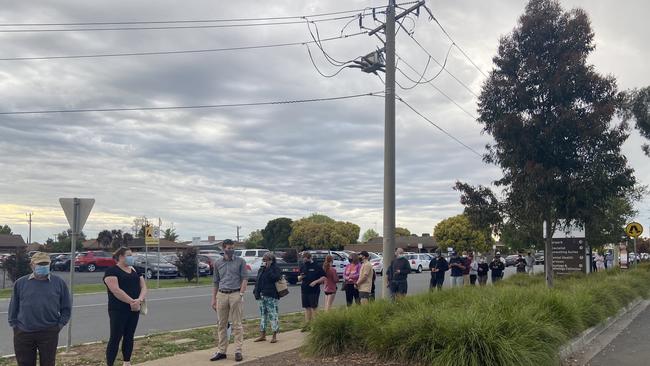 Shepparton locals queue to enter the testing centre on Thursday. Picture: Madi Chwasta