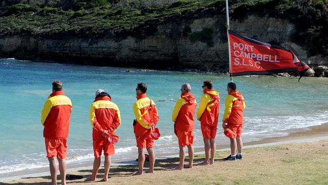 Lifeguards pause for a minute's silence. Picture: Andrew Henshaw