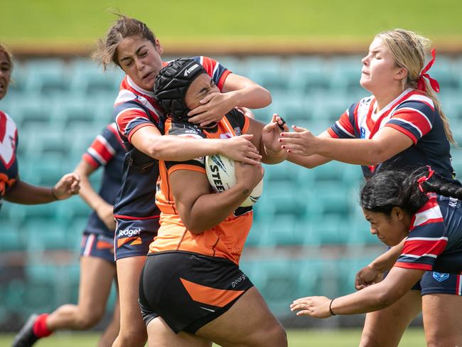 Alavina Tu'ifua is hit with a high tackle. Picture: Julian Andrews