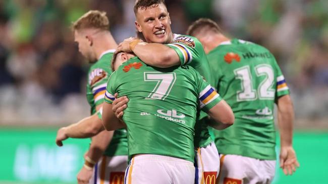 Wighton hugs halfback george Williams.