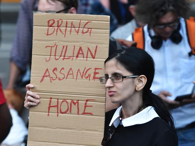 Supporters of WikiLeaks founder Julian Assange rally outside the Victorian State Library in Melbourne. Picture: AAP