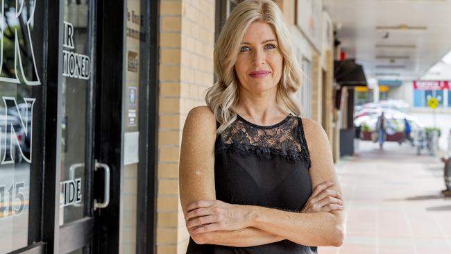 Simone Schofield from Ashmore Plaza Hair Design is sick of her customers being harassed by people hanging around the complex asking for money for buy. Picture: Jerad Williams