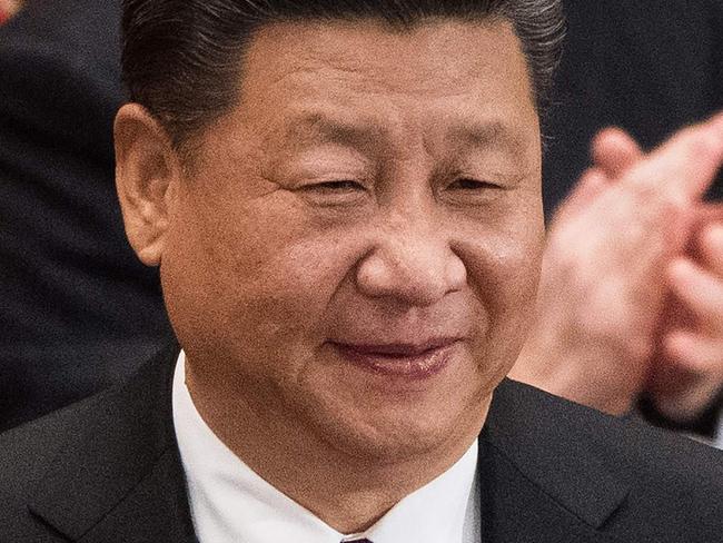 Wang Qishan (L), former secretary of the Central Commission for Discipline Inspection, shakes hands with China's President Xi Jinping (R) after Wang was elected as China's Vice President during the fifth plenary session of the first session of the 13th National People's Congress (NPC) at the Great Hall of the People in Beijing on March 17, 2018. China's rubber-stamp parliament unanimously handed President Xi Jinping a second term on March 17 and elevated his right-hand man to the vice presidency, giving him a strong ally to consolidate power and handle US trade threats. / AFP PHOTO / NICOLAS ASFOURI