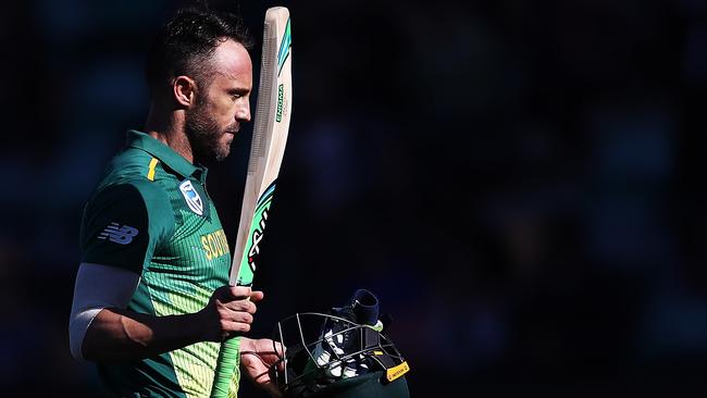 Faf du Plessis raises his bat as he leaves the ground after being dismissed for 125 runs in Hobart.