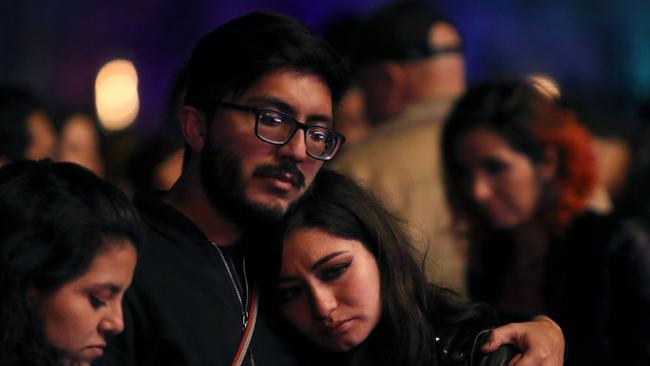 Music fans react after hearing of the death of Foo Fighters drummer Taylor Hawkins, at the Estereo Picnic festival in Bogota. Picture: Juan Pablo Pino / AFP