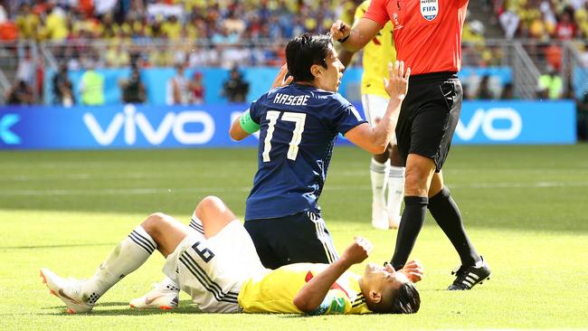 Japan’s Makoto Hasebe protests his innocence after a free kick was awarded to Colombia’s Radamel Falcao. Picture: Getty Images