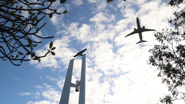 A Royal Australian Air Force P-8A Poseidon from the No. 11 Squadron flies over the Cairns Catalina Memorial on the Esplanade to mark the beginning of the Catalina A24-50 commemorative ceremony. Picture: Arun Singh Mann