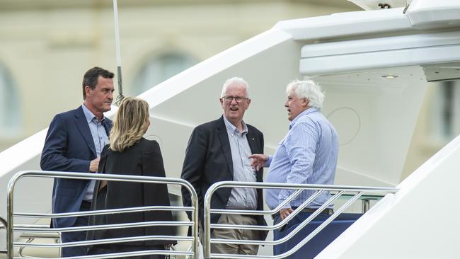 Clive Palmer, right, hosting Gary Spence, left, and Bruce McIver aboard the Nancy Jean on election night. Picture: Mark Cranitch.