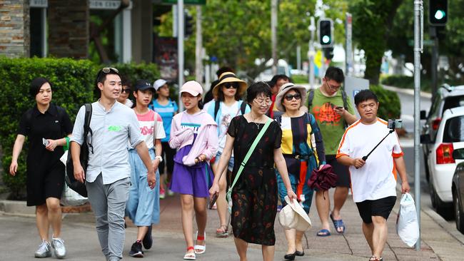 Chinese visitors to Cairns are spending more money than tourists from any other country. A tour group of Chinese on Spence Street in the Cairns CBD. PICTURE: BRENDAN RADKE