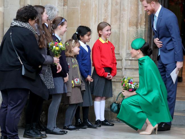 The couple took a moment to chat with young fans. Picture: Getty Images