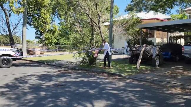 Councillor Donna Kirkland leaving flowers on Bean St