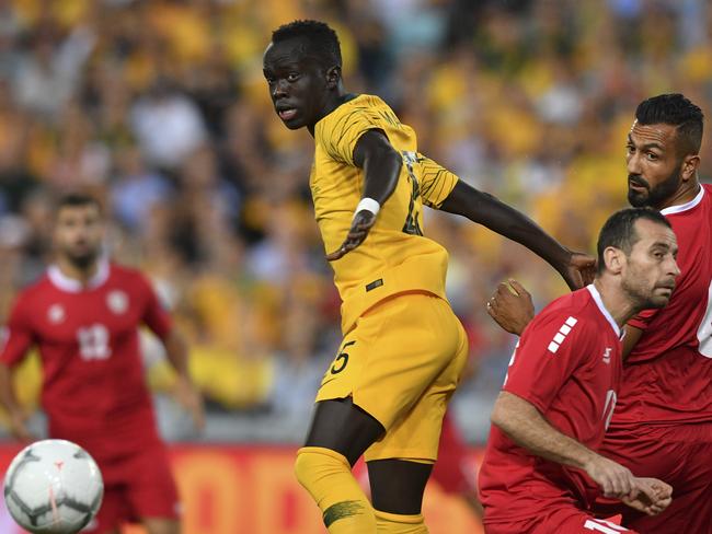 Awer Mabil (left) of Australia competes for possession  against Lebanon during the International friendly match between Australia and Lebanon at ANZ Stadium in Sydney, Tuesday, November 20, 2018. (AAP Image/Brendan Esposito) NO ARCHIVING, EDITORIAL USE ONLY