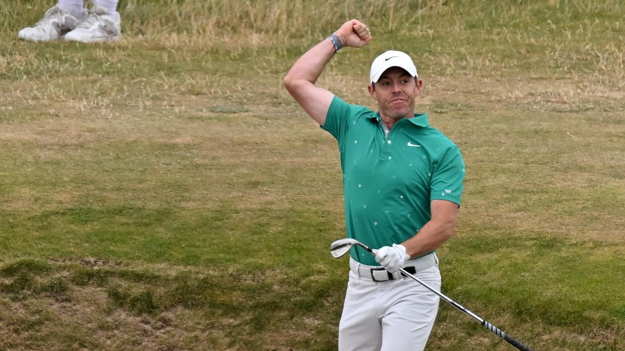 Northern Ireland's Rory McIlroy celebrates after holing a bunker shot for an eagle on the 10th hole during his third round on day 3 of The 150th British Open Golf Championship on The Old Course at St Andrews in Scotland on July 16, 2022. (Photo by Glyn KIRK / AFP) / RESTRICTED TO EDITORIAL USE