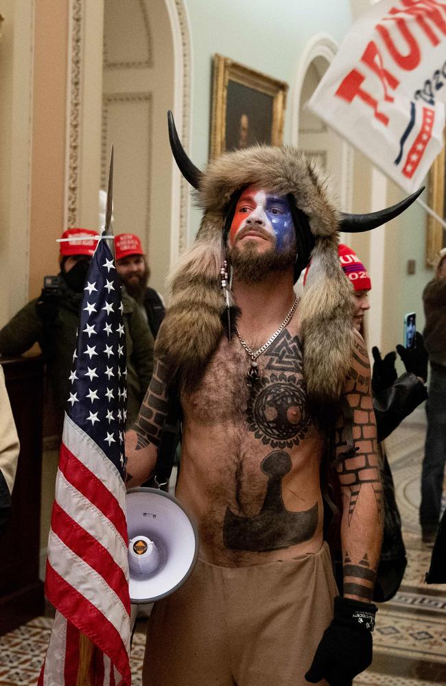 The horned man among protesters who stormed the US Capitol on Wednesday has been revealed as actor and hardcore Trump supporter, Jake Angeli. Picture: Saul Loeb/AFP