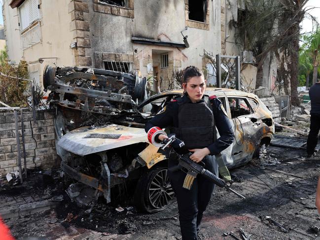 A member of the Israeli security forces stands guard inside a cordoned-off area in Kiryat Bialik in the Haifa district of Israel, targeted by a reported strike by Lebanon's Hezbollah on September 22. Picture: Jack Guez / AFP