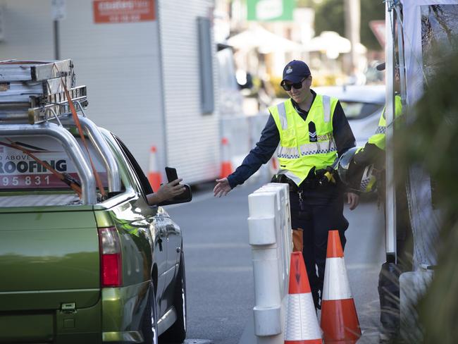 Police check people at the Queensland border. Picture: Nigel Halett