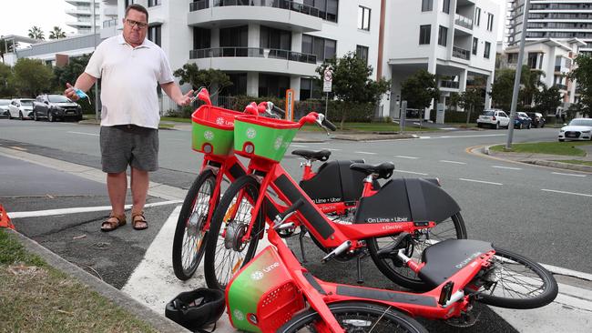 Southport residents are fed up with Lime e-bikes being dumped on streets. Southport resident Michael Black pictured in Como Crescent Southport. Picture Glenn Hampson