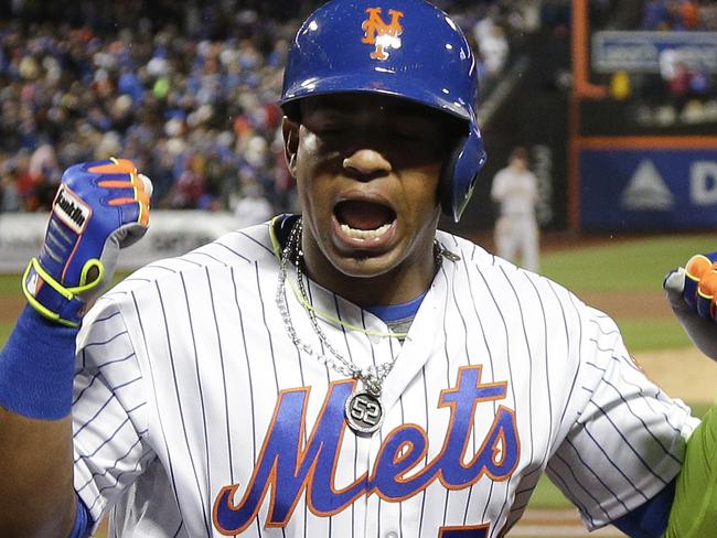 FILE - In this April 29, 2016, file photo, New York Mets' Yoenis Cespedes (52) reacts after hitting a grand slam home run against the San Francisco Giants during the third inning of a baseball game, in New York. A person familiar with the negotiations says outfielder Yoenis Cespedes and the New York Mets have agreed to a $110 million, four-year contract. The person spoke on condition of anonymity Tuesday, Nov. 29, 2016, because the agreement is subject to Cespedes successfully completing a physical. (AP Photo/Julie Jacobson, File)