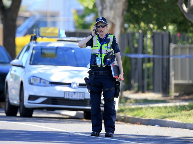 A police officer at the scene where a child has been found in a car. Picture: Mark Stewart