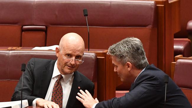 Justice Party Senator Derryn Hinch speaks to Labor Senator Doug Cameron (top) as Liberal Democratic Party Senator David Leyonhjelm speaks to Minister for Finance Senator Mathias Cormann in the Senate chamber at Parliament House in Canberra, Thursday, March 22, 2018. (AAP Image/Mick Tsikas) NO ARCHIVING