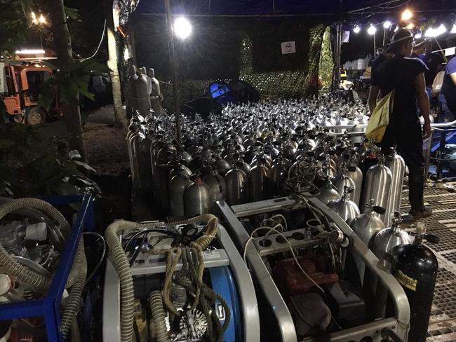 Oxygen tanks are prepared for rescue divers near the entrance of Tham Luang cave. Picture: AFP