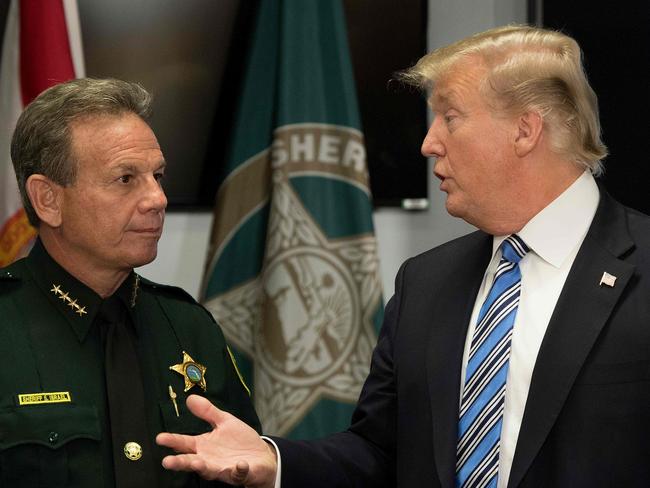 Mr Trump speaks with Broward County Sheriff Scott Israel following last week’s deadly shooting. Picture: Jim Watson/AFP